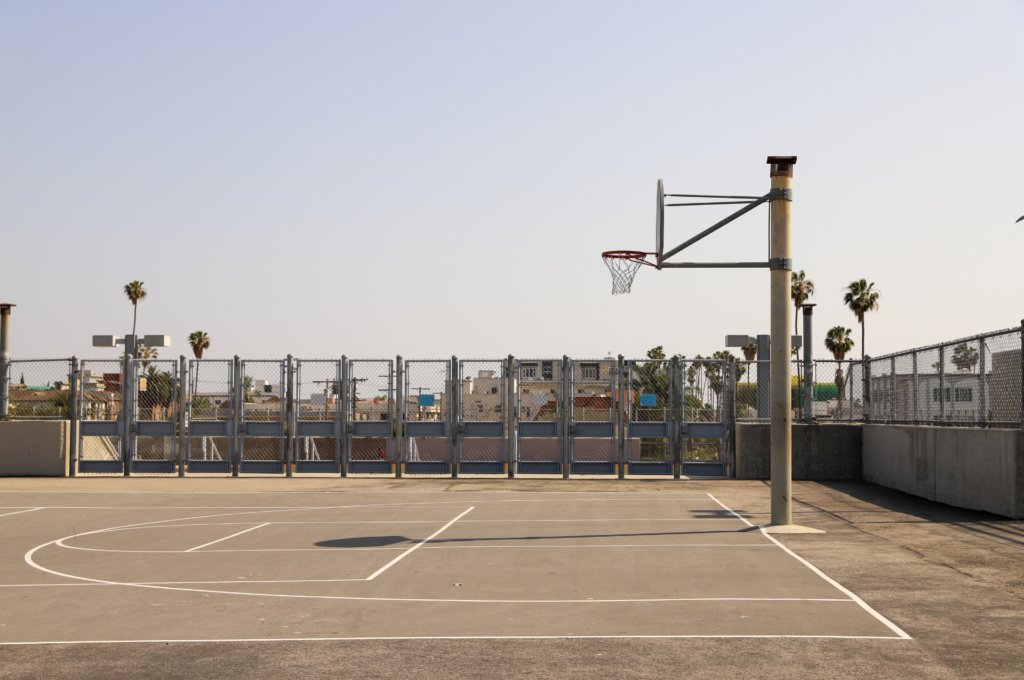 Professional basketball court with official dimensions, hoop, and net