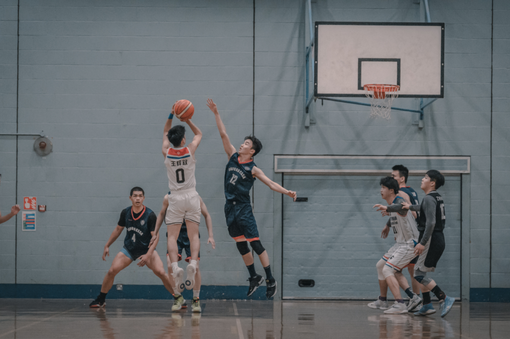 Basketball Action Unfolds: Intense Team Play