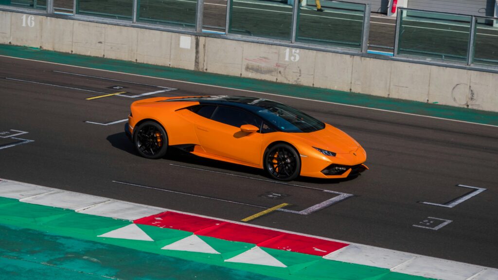 Lamborghini Sports Cars: Orange Huracán in Action on the Race Track